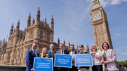 Tom Gordon alongside the team from Yorkshire Cancer Research stood in front of the Houses of Parliament