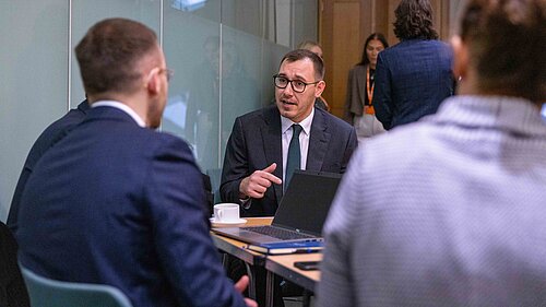 Tom pictured in a meeting.