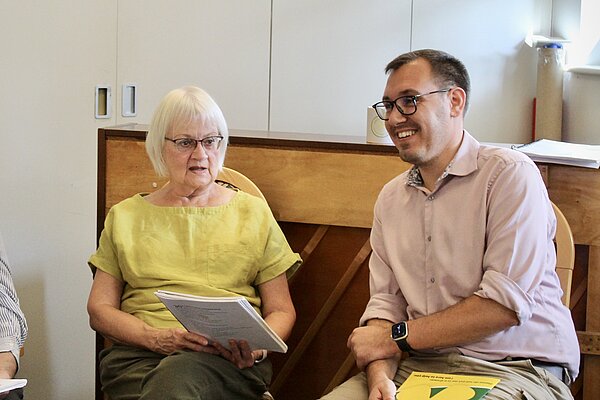 Tom Gordon MP sat listening to a resident