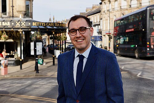 Tom Gordon MP stood in the centre of Harrogate