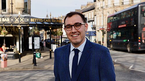 Tom Gordon MP stood in the centre of Harrogate