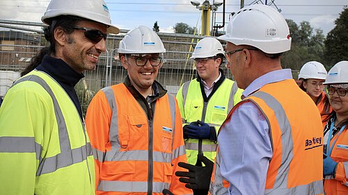 Tom Gordon speaking with workers at the water sewage treatment plant