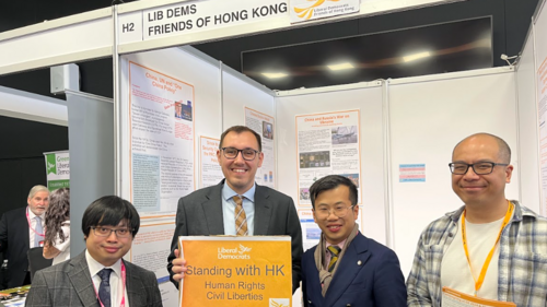 Tom Gordon MP with Standing with Hong Kong sign - with people from HK