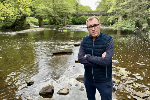 Tom Gordon standing by the River Nidd