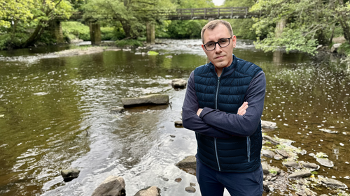 Tom Gordon standing by the River Nidd