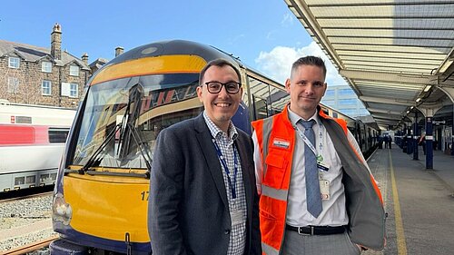 Tom Gordon stood in front of a train at Harrogate station