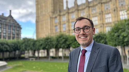 Tom Gordon, Liberal Democrat MP stood outside parliament