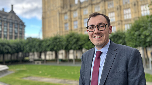 Tom Gordon stood outside the Houses of Parliament