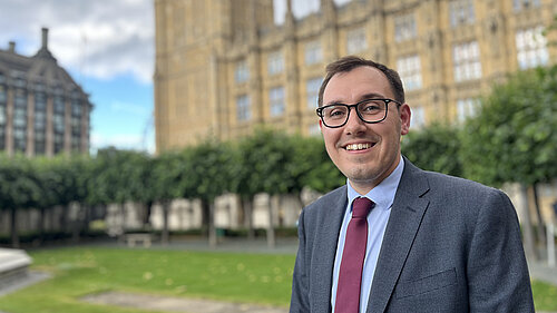 Tom Gordon stood outside the Houses of Parliament