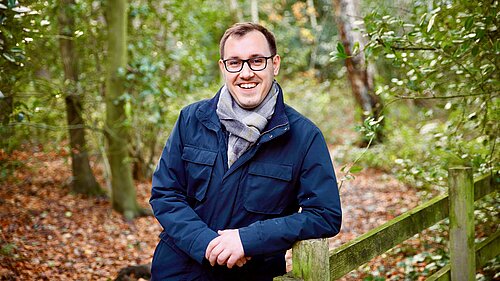 Tom Gordon smiling in a forest in Bilton