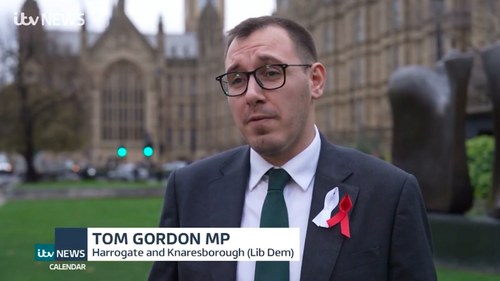 Tom Gordon stood outside the Houses of Parliament