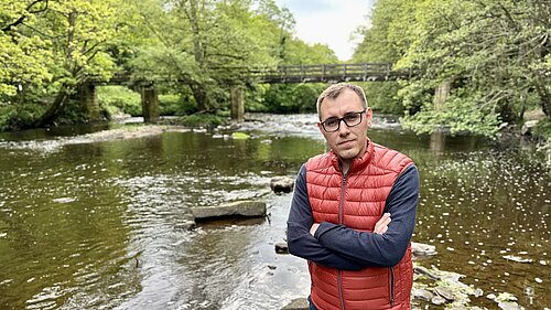 Tom Gordon MP stood by river Nidd