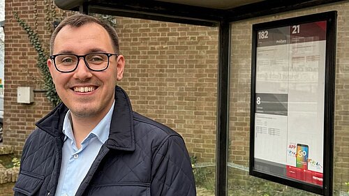 Tom Gordon stood at a bus stop in Harrogate