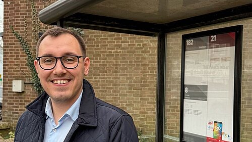 Tom Gordon stood at a bus stop in Harrogate