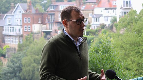 Tom Gordon MP speaking to a reporter in Kmaresborough