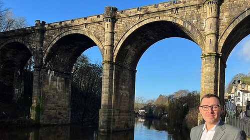 Tom Gordon stood next to the River Nidd by the Knaresborough viaduct