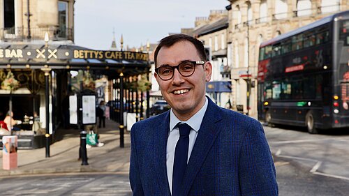 Tom Gordon stood outside Betty's main site in Harrogate