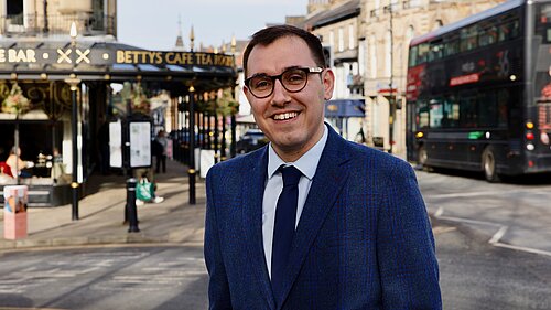 Tom Gordon stood outside Betty's on Parliament, in Harrogate town centre