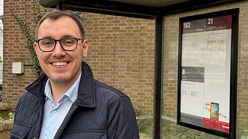 Tom Gordon stood at a bus stop