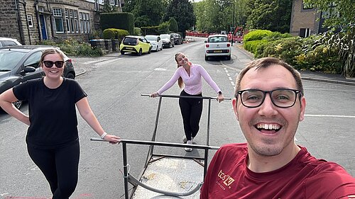 Tom Gordon with members of his staff team and the bed race bed