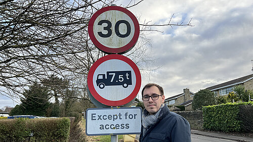 Tom Gordon stood by a 30 speed limit sign